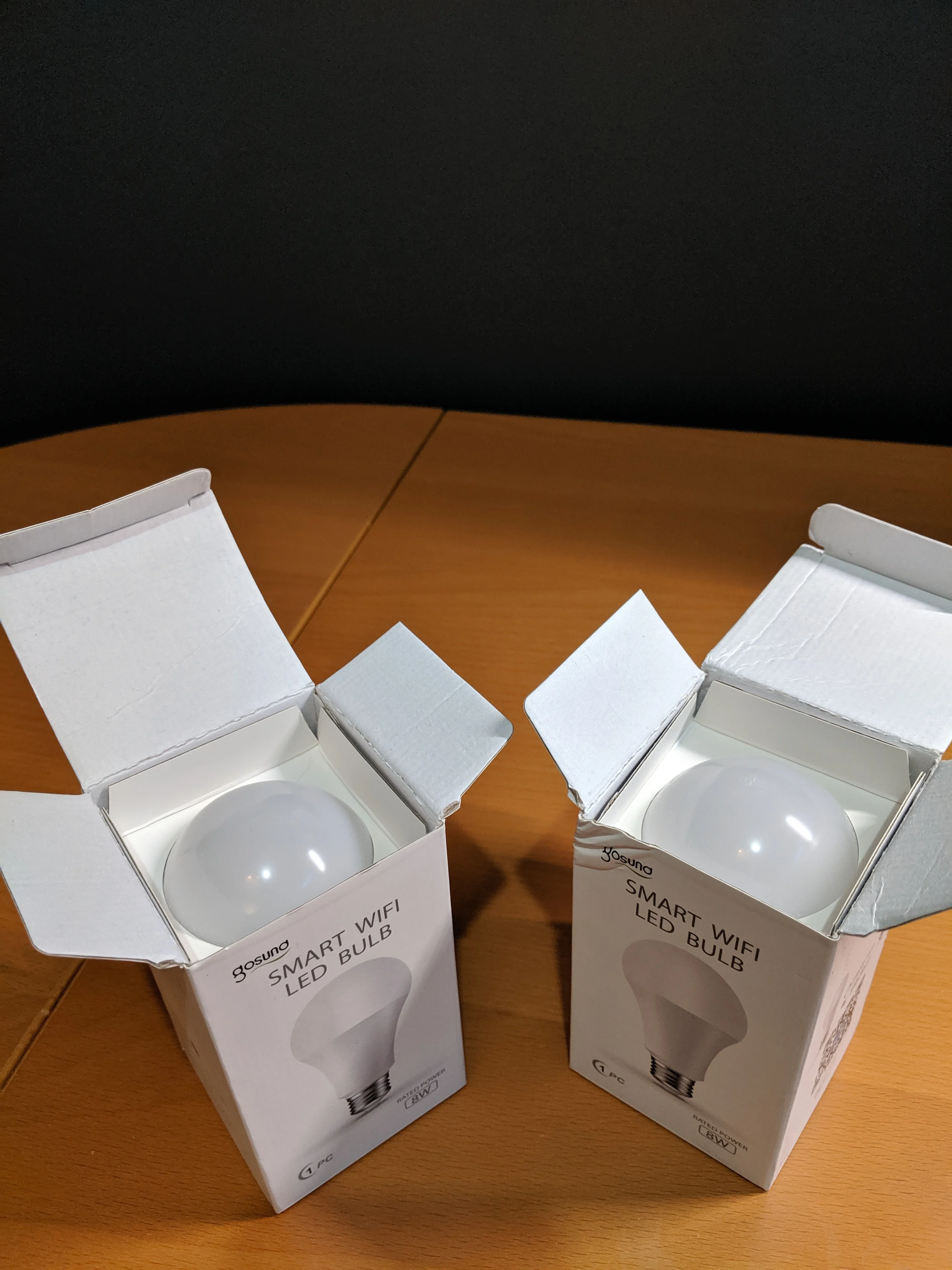 A pair of Gosund Smart Wifi LED Bulb Box Opened and arranged on table