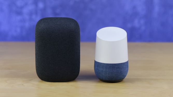 Nest Audio with Google Home sitting on table with purple background