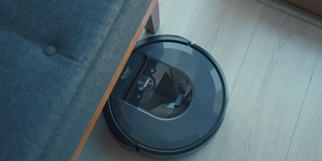 A Roomba iRobot cleaner in black