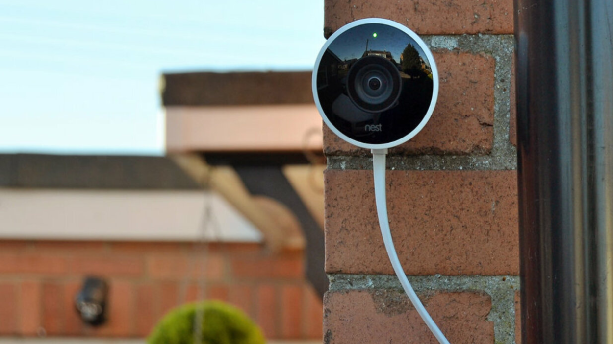 Nest Cam mounted on a brick wall.