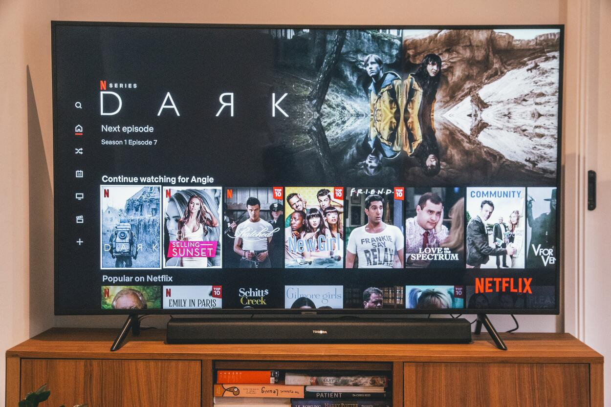 Samsung TV with a sound bar playing Netflix