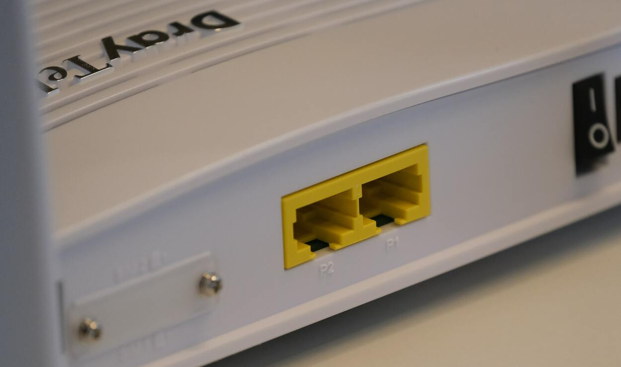 A close shot of two ports of a router.