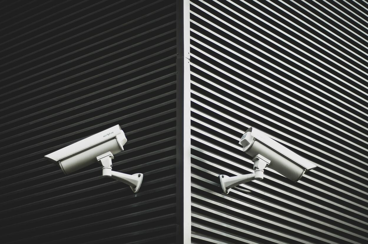 two CCTV cameras pointing in opposite directions