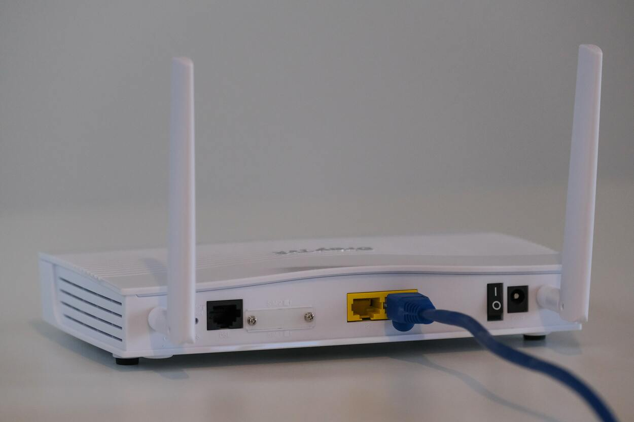 A simple router with a power cable connected to it