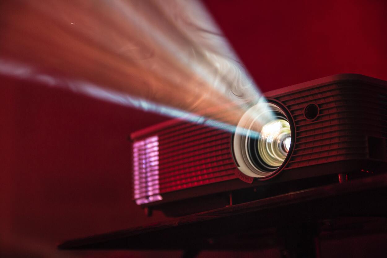 Picture of a projector displaying a video. 