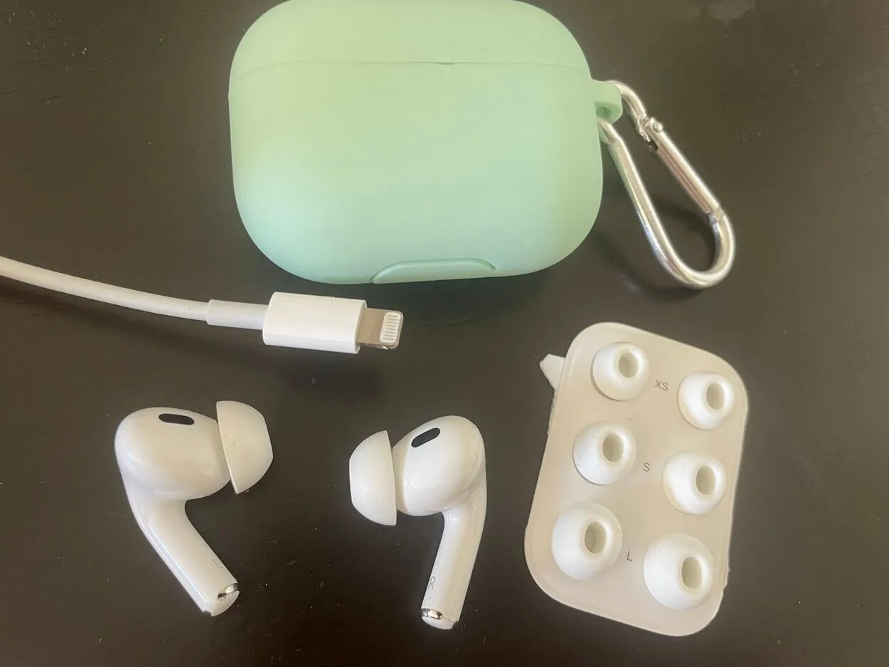Airpods Pro, with their case, additional ear fit sizes and a lightening charger.