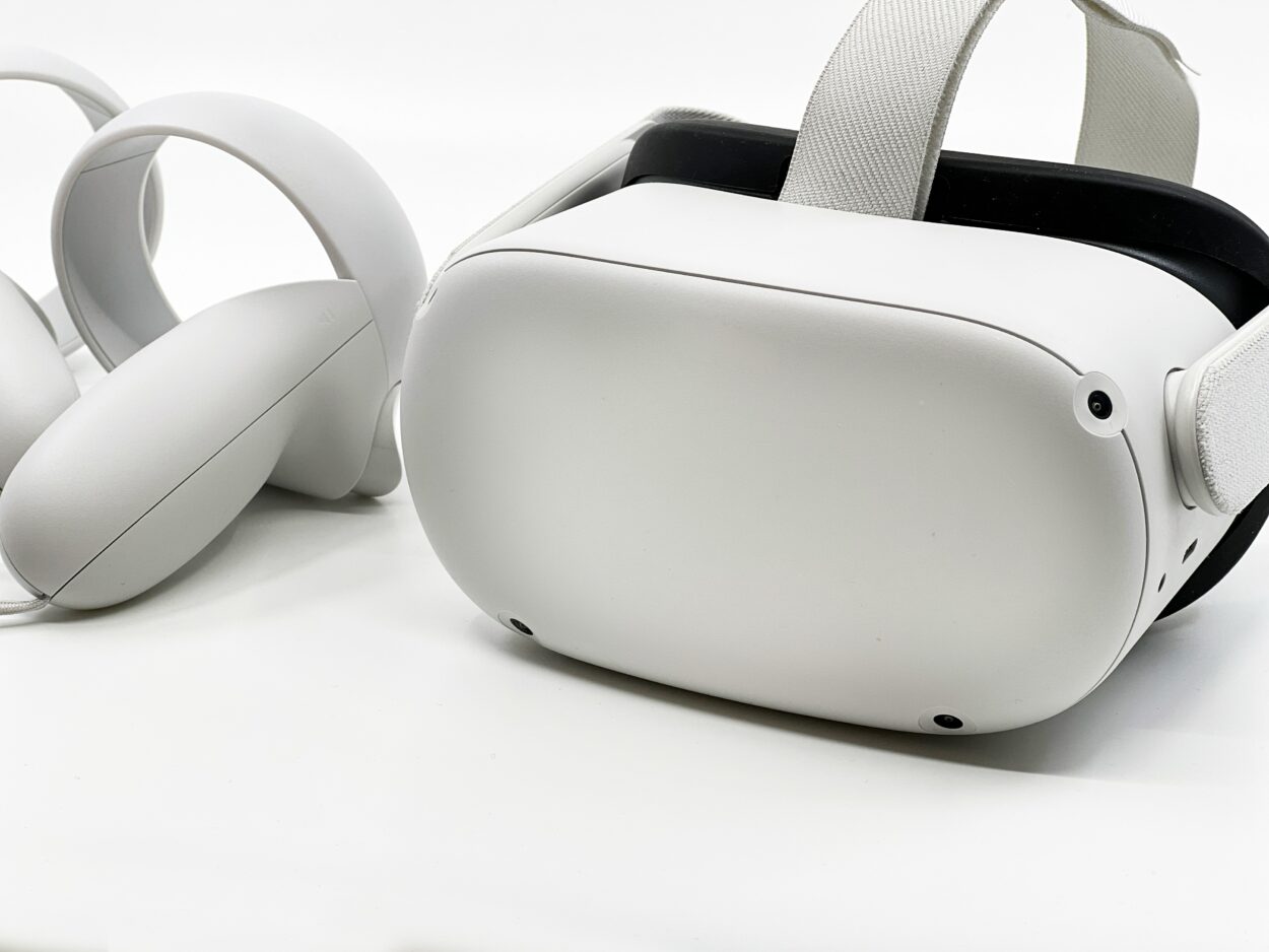Oculus placed with its controllers on white surface