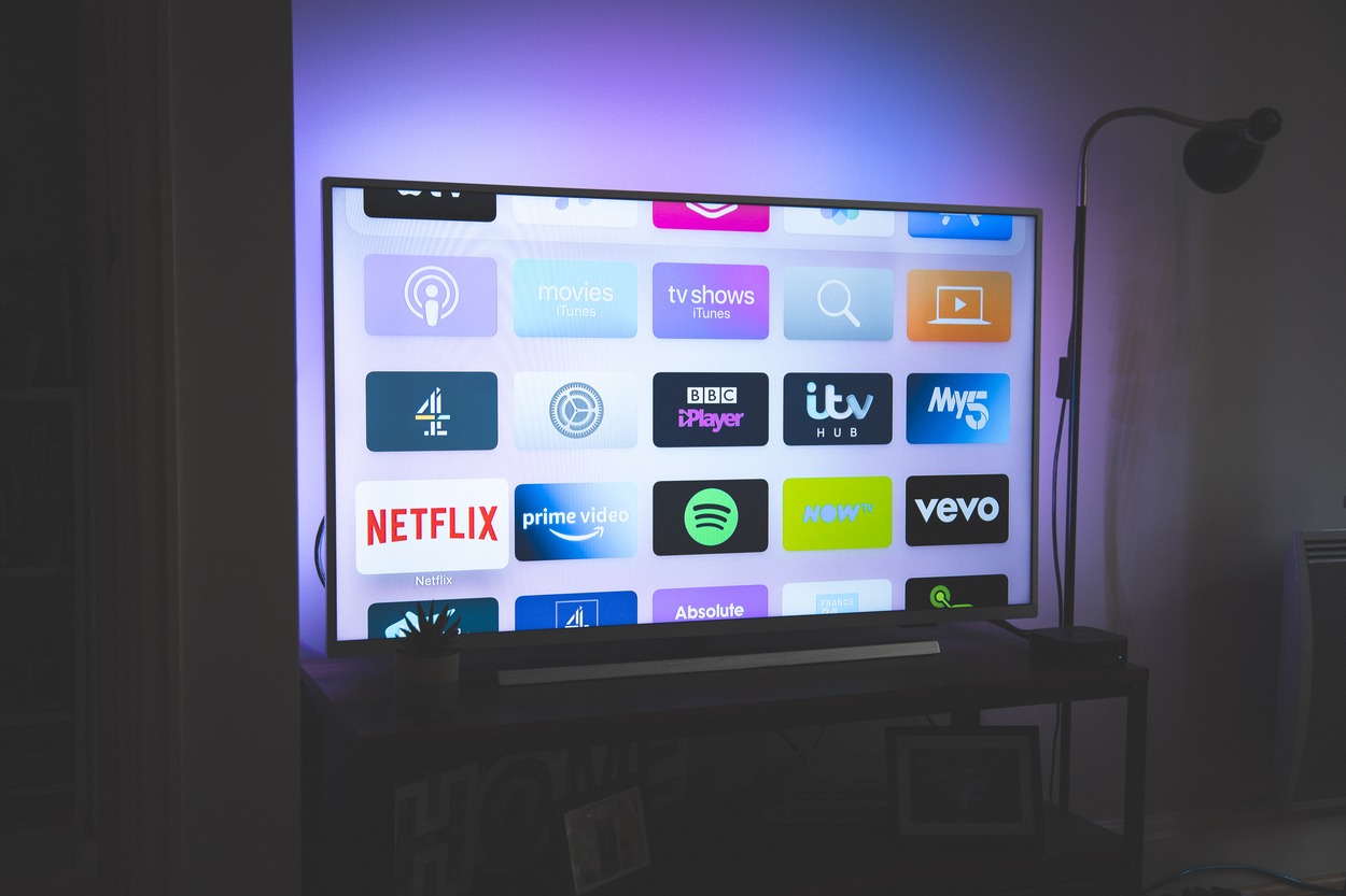 A big tv screen with multiple apps.