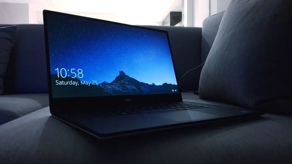 Dell laptop with an night wallpaper.