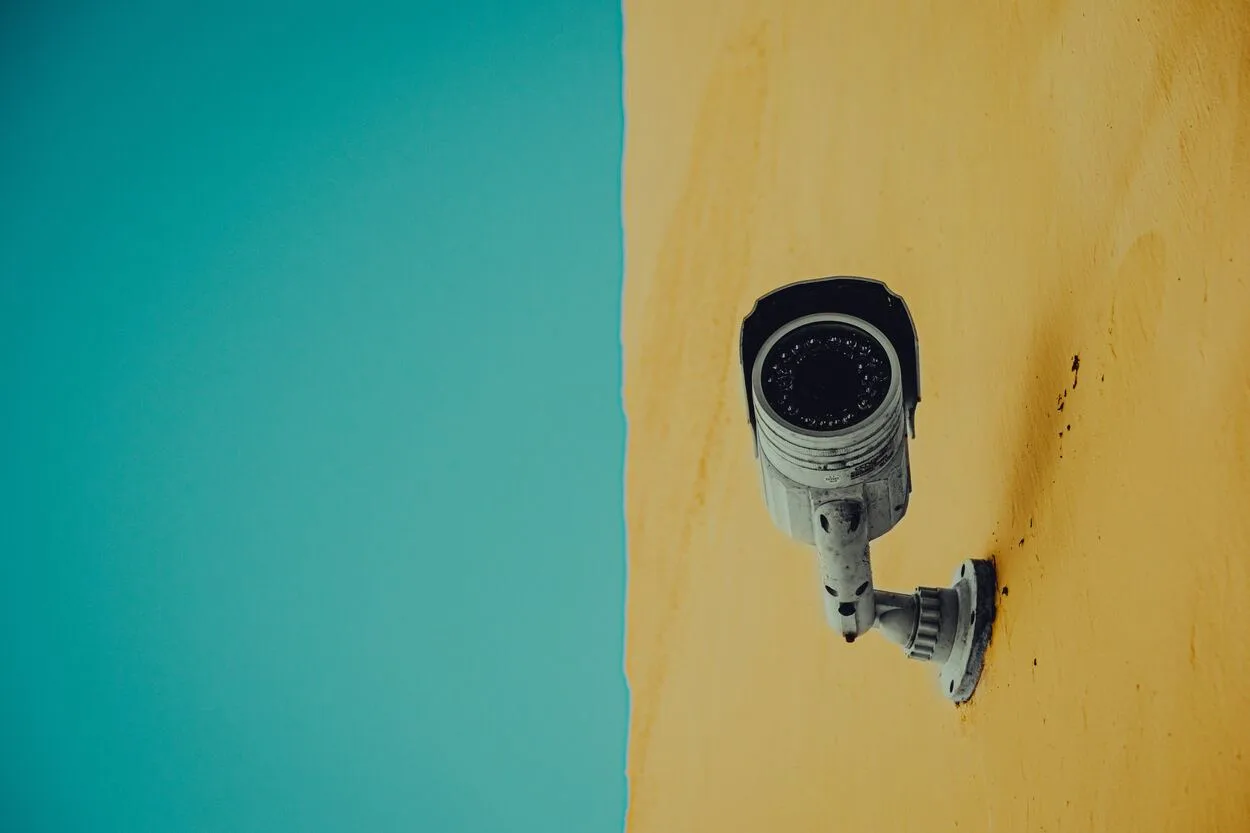 A camera installed at yellow and blue colored wall