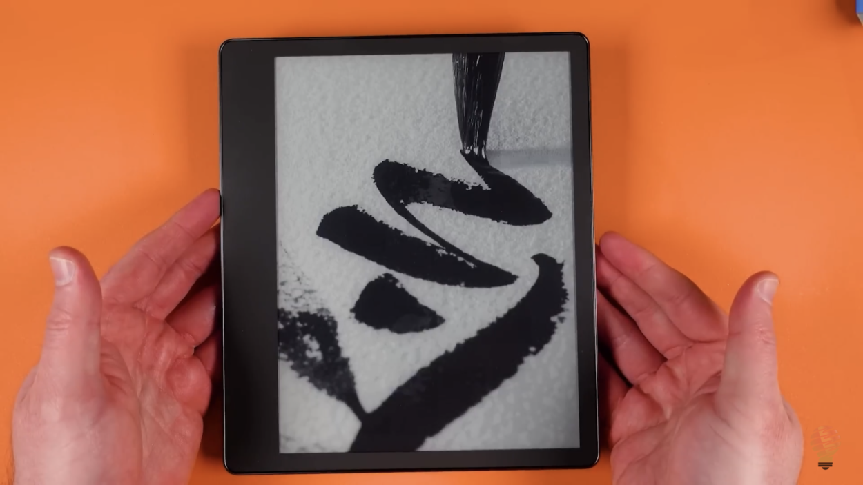 A person holding the Amazon Kindle Scribe