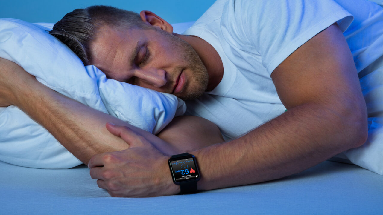 Man sleeping with smart watch