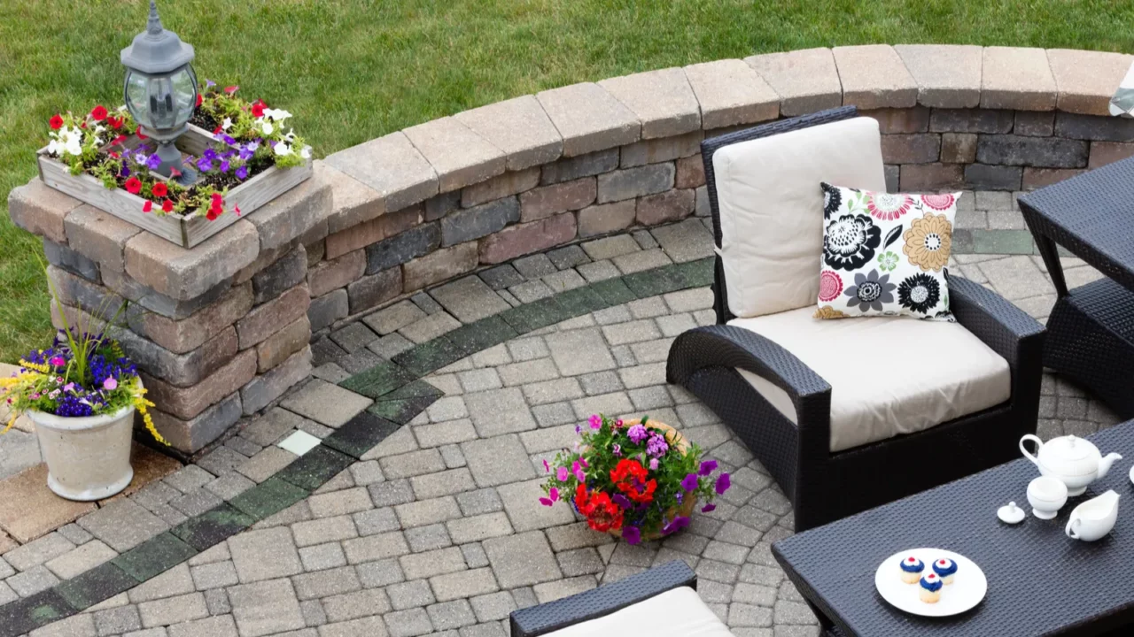 Patio with comfortable furniture and colorful lovely flowers.