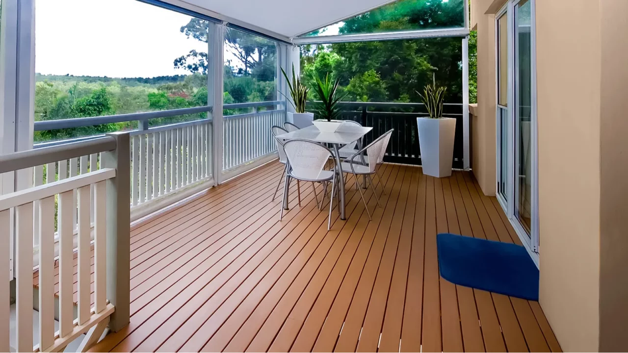 Home terrace with wooden floor and table.