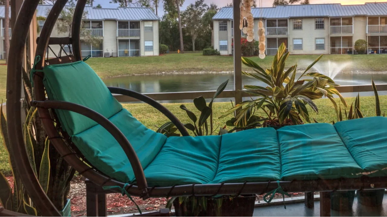 Green swinging lounge chair on lanai.