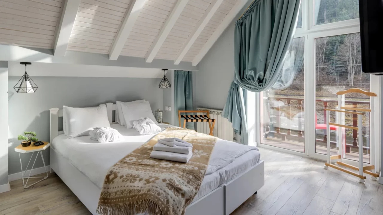 bright attic bedroom featuring modern decor natural light and stunning