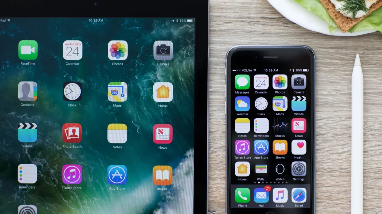 ipad pro and iphone with home screen in the table