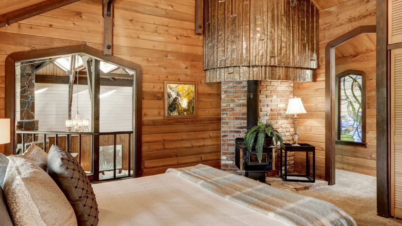wooden bedroom interior with high vaulted ceiling