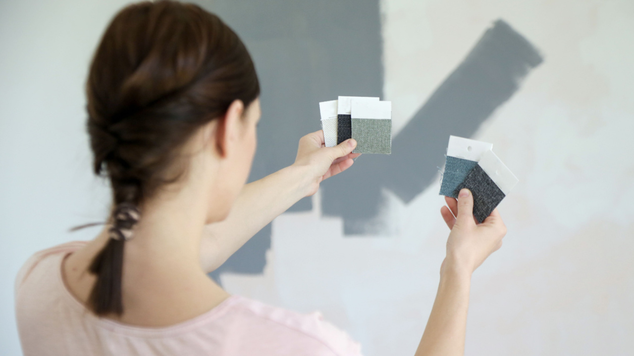 Young woman choosing a perfect shade of grey