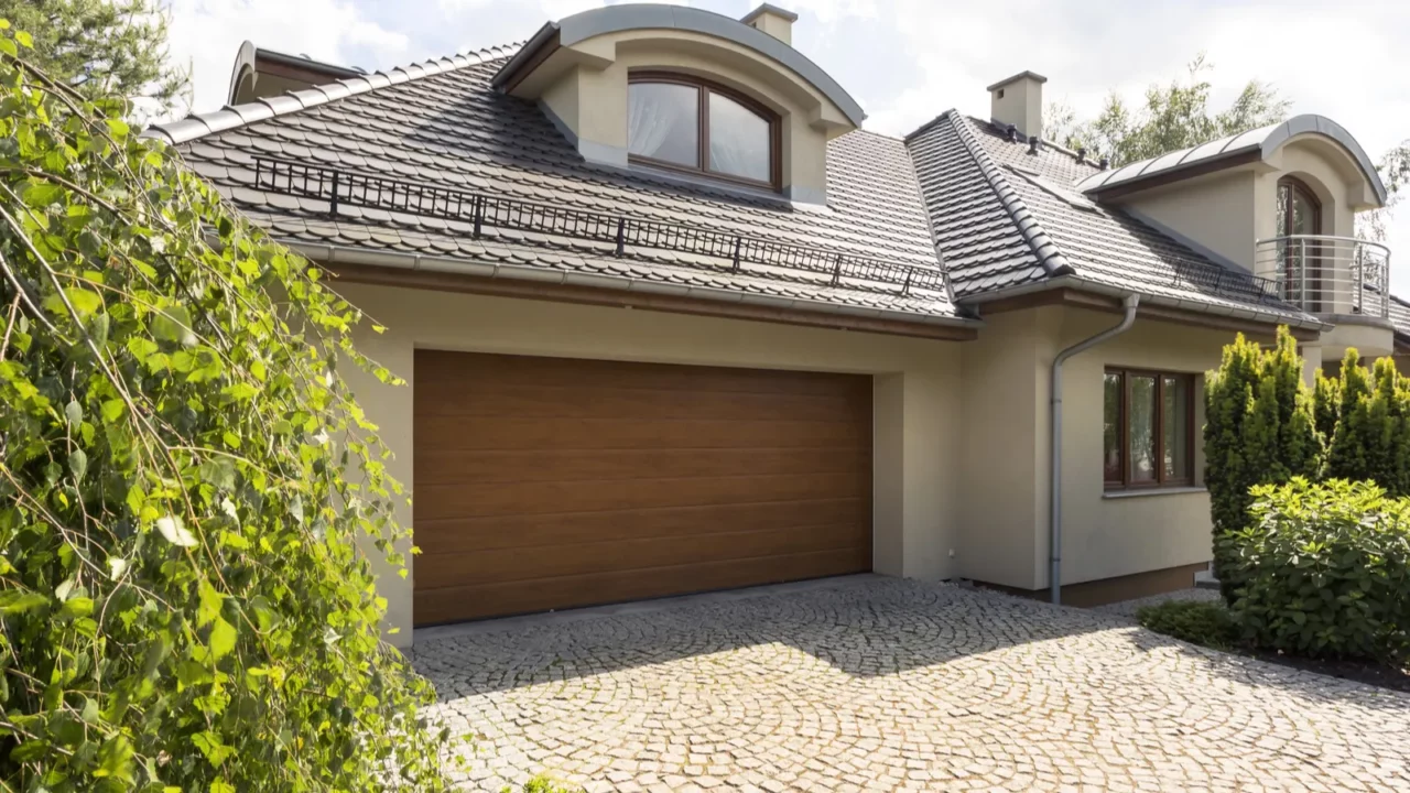 detached house exterior with cobblestone driveway