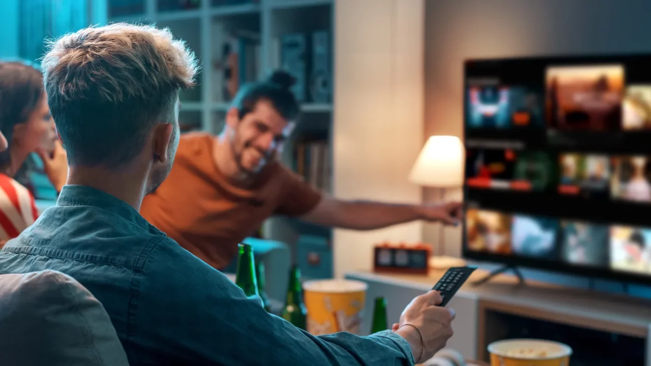 friends choosing a movie to watch together at home video