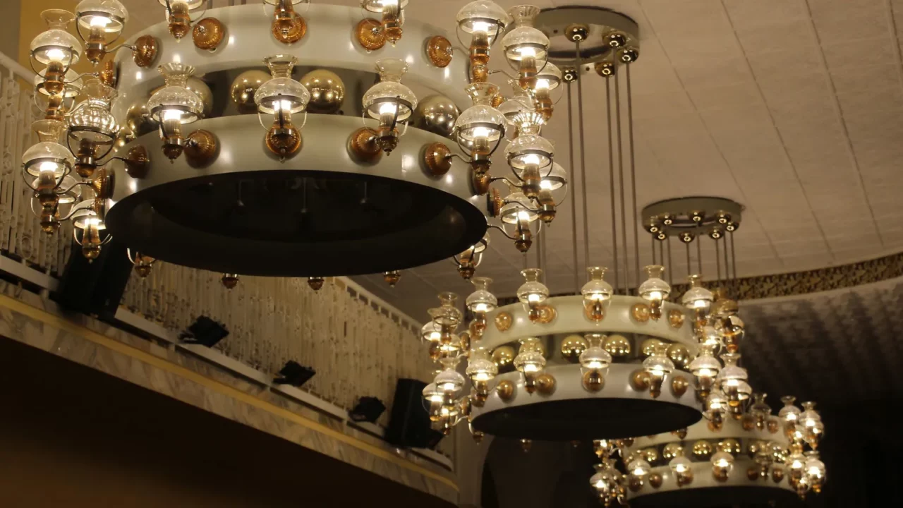 A large vintage chandelier hangs from the ceiling