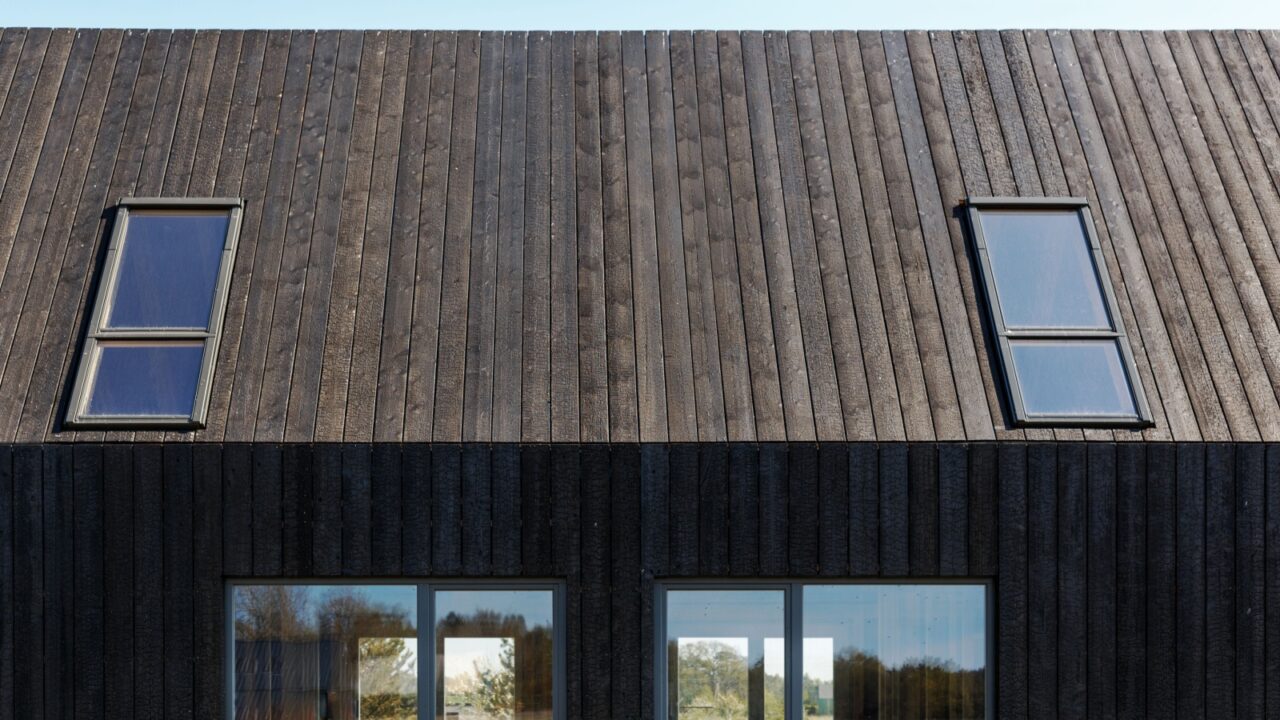 Building facade made of charred wooden boards.