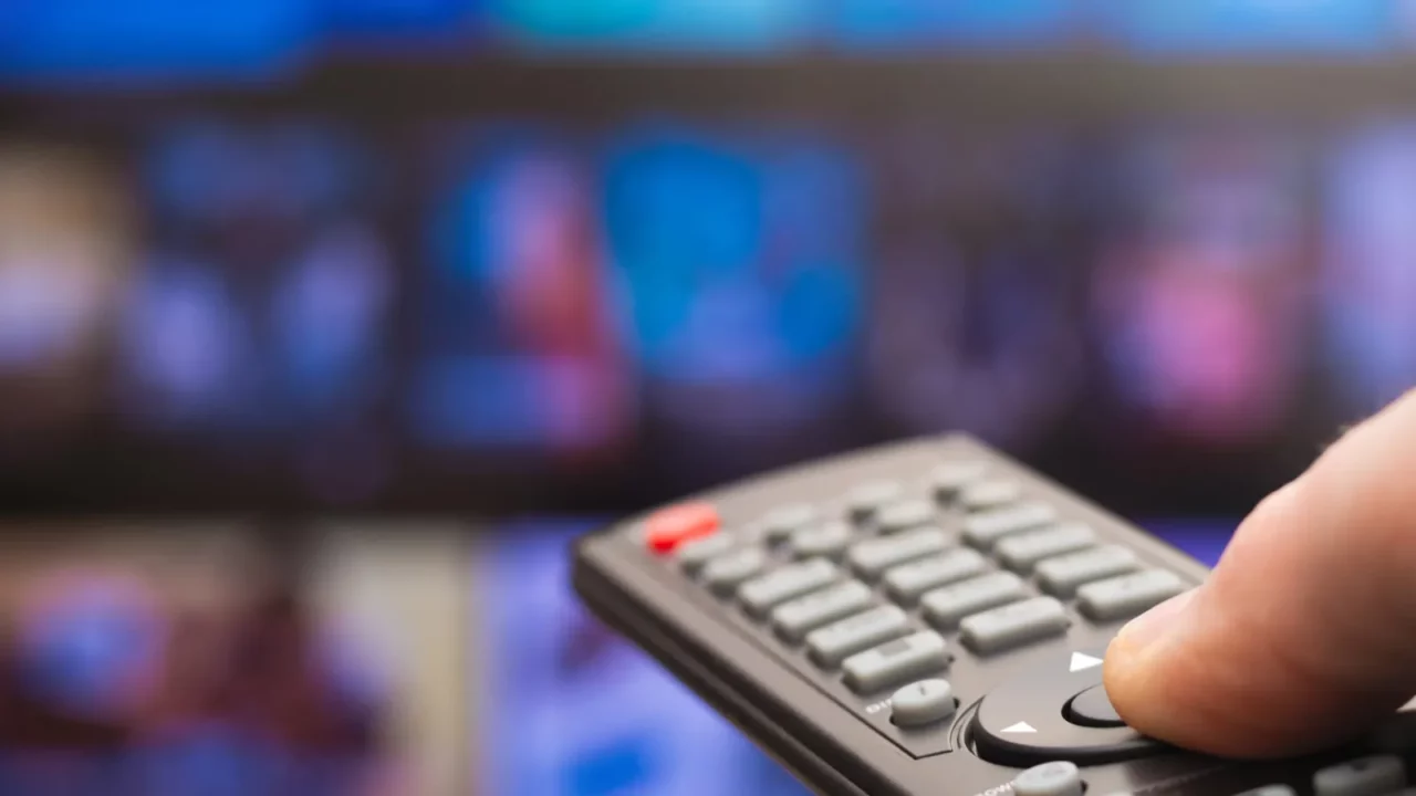 tv remote in hand