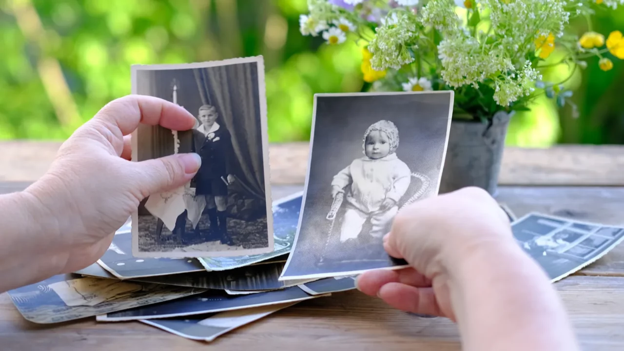 female hands fingering set of vintage photos 1950 photographs on