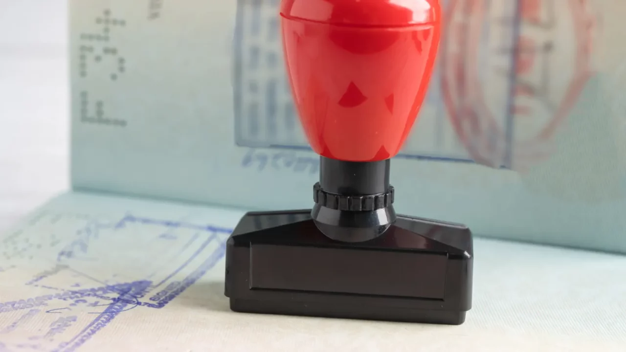 approved stamp visa and passport document to immigration at airport